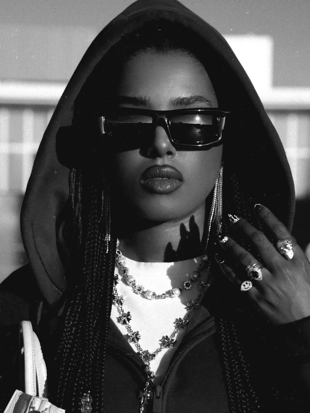 Marla McLeod in a black hood and sunglasses